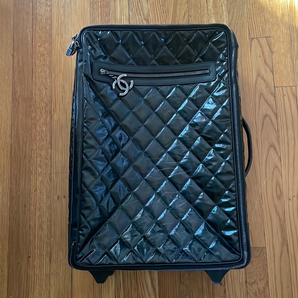 Chanel Carry on rolling luggage . classic plaid.